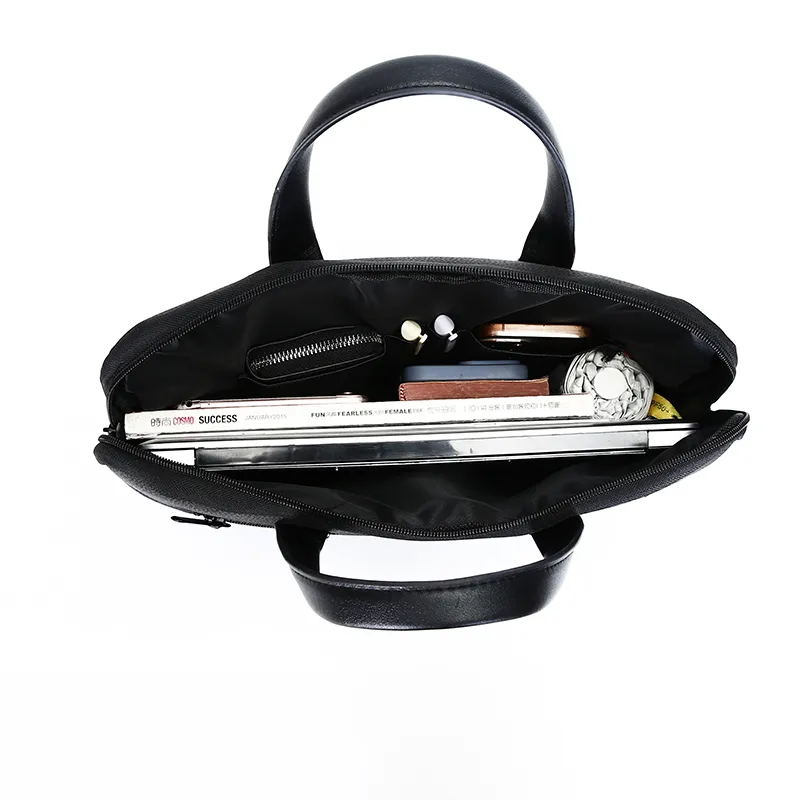 Custom Laptop Briefcase Bags with Logo: A B2B Buying Guide for Corporate Travel and Employee Kits 3 Open customizable briefcase with books and small items inside