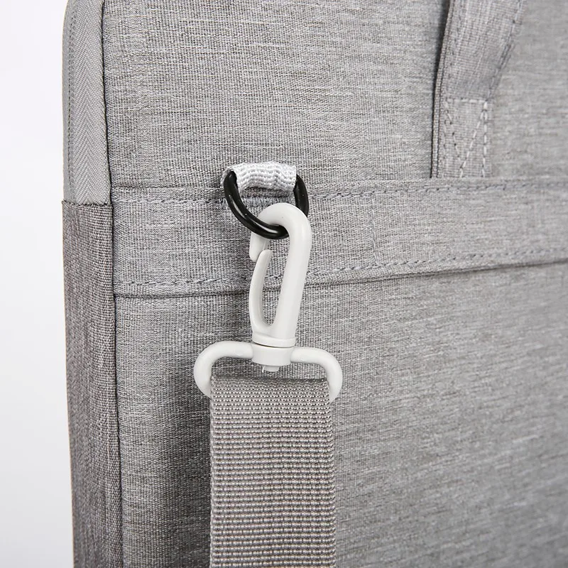 Close-up of the detachable shoulder strap hardware on Model 162 laptop briefcase bag