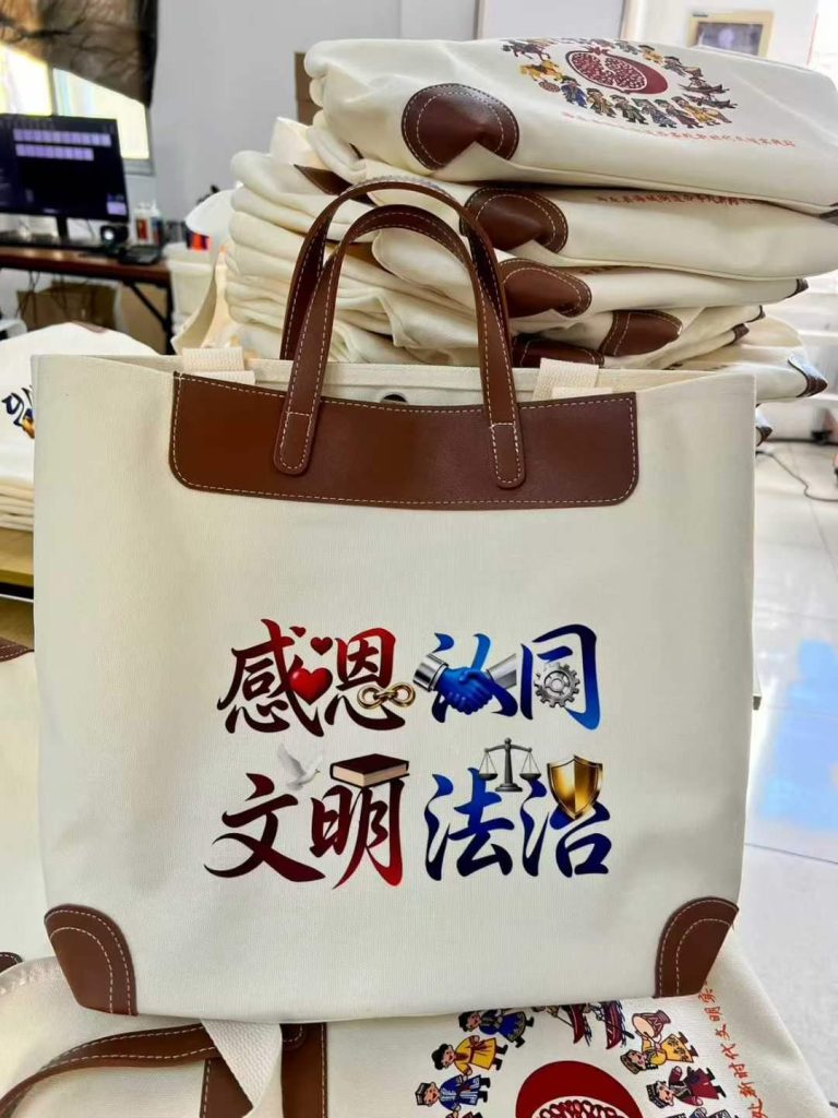 Canvas tote bag with brown PU leather yoke, leather handles and corner patches