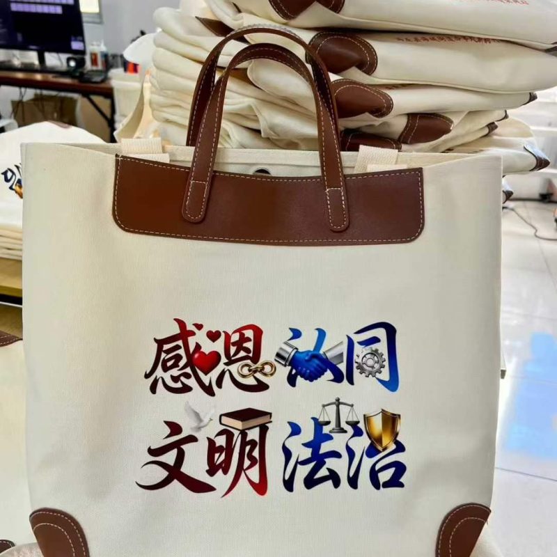Canvas tote bag with brown PU leather yoke, leather handles and corner patches