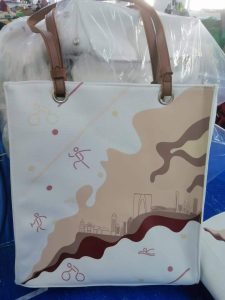 Custom printed canvas tote bag with city and sports artwork and leather handles