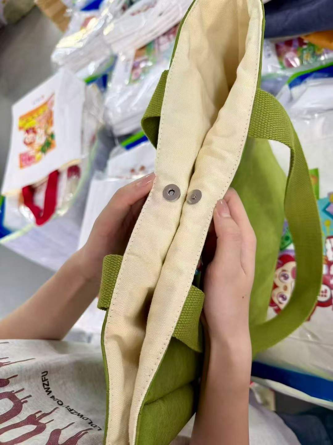 Custom DuPont Paper Tote Bag - Canvas-Lined, 4 Colors 3 Magnetic snap closure detail on DuPont paper tote bag