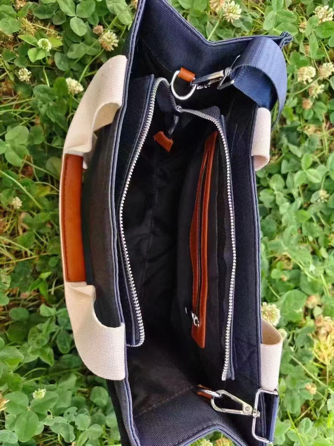 Custom Navy Oxford Tote Bag with Detachable Shoulder Strap 2 Interior of the navy oxford tote bag with zip pocket, black lining and detachable strap hooks